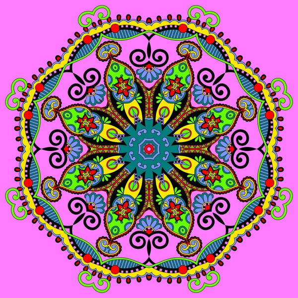 Colorful ornamental mandala with symmetrical floral patterns and decorative swirls on pink background