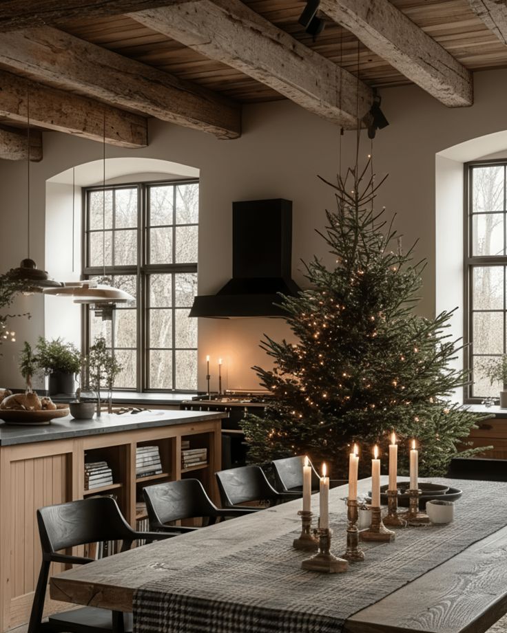 Rustic kitchen interior with a Christmas tree, candles on a wooden table, and arched windows