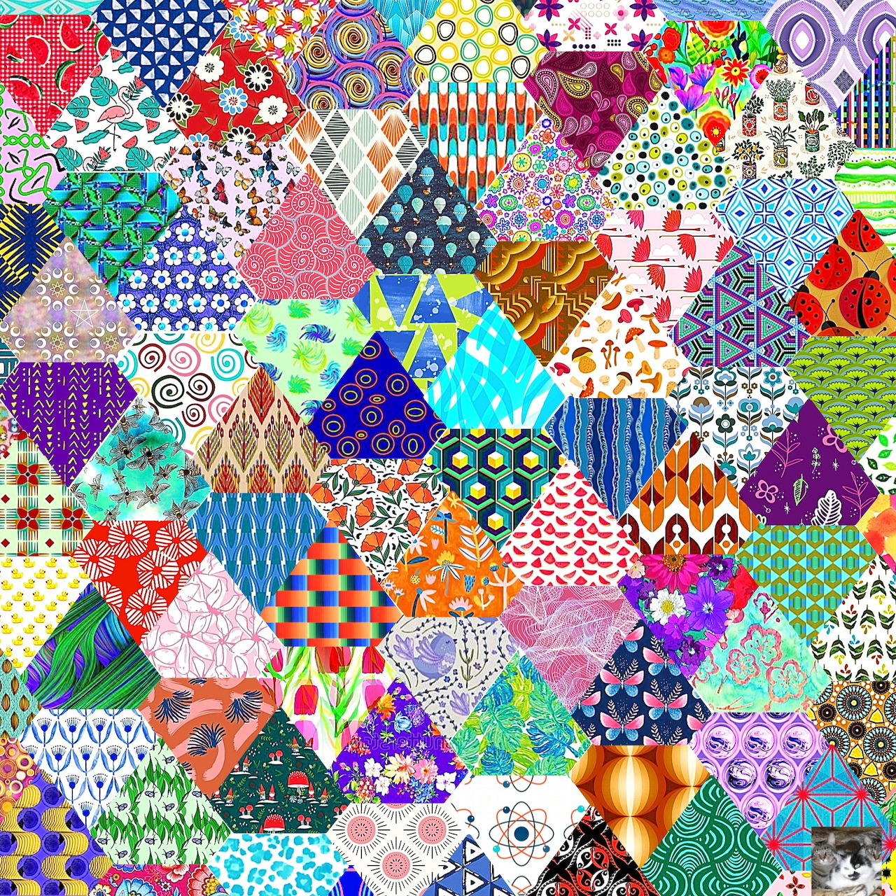 Colorful hexagonal patchwork quilt with diverse patterns including dots, stripes, florals and geometric designs