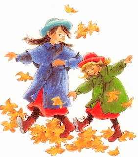 Two girls in blue and green coats playing joyfully among falling autumn leaves