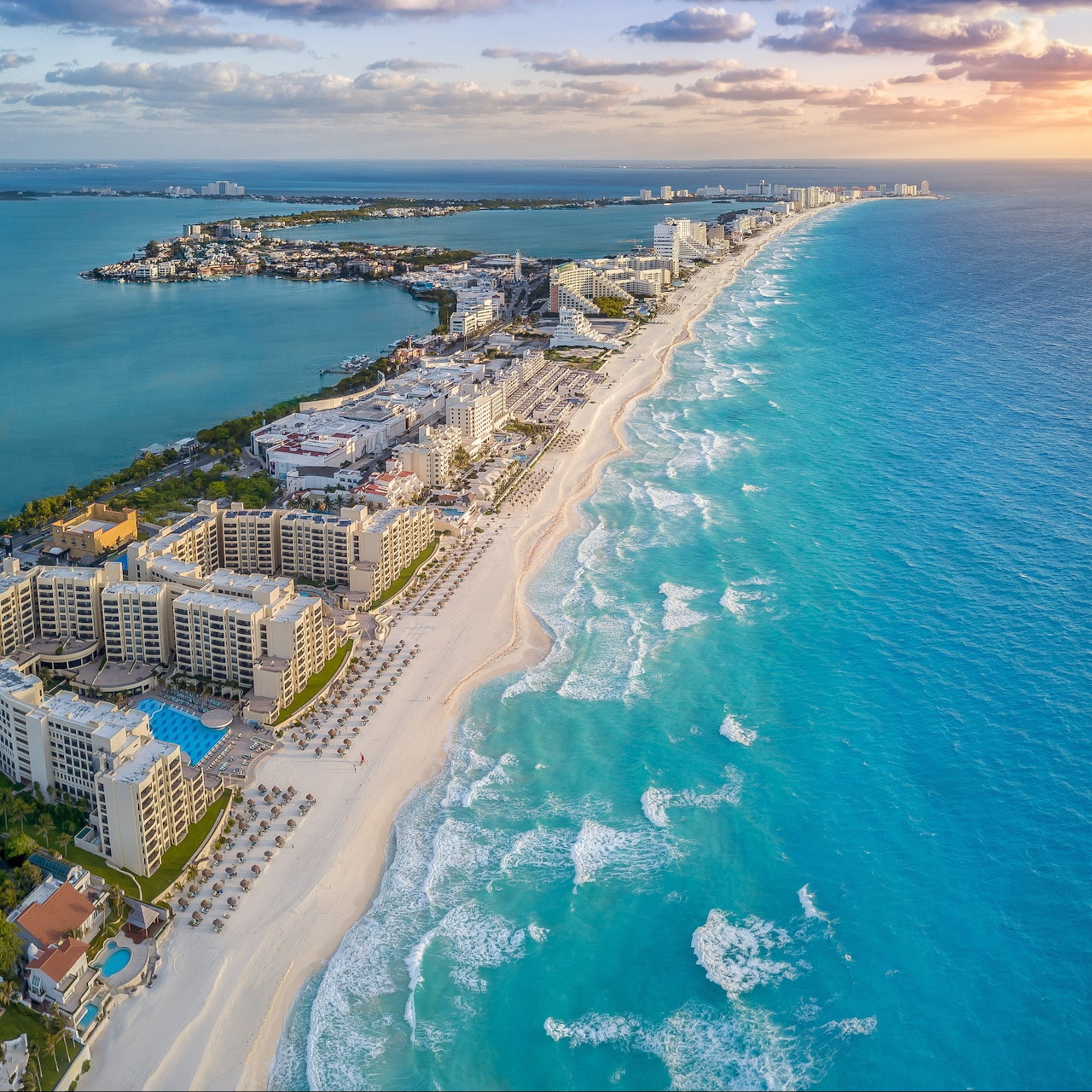 Aerial photograph of Cancun beach resort strip with turquoise ocean and white sand
