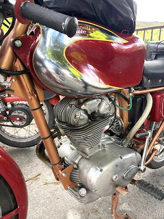 Vintage Ducati 200 Elite motorcycle engine with red and chrome fuel tank