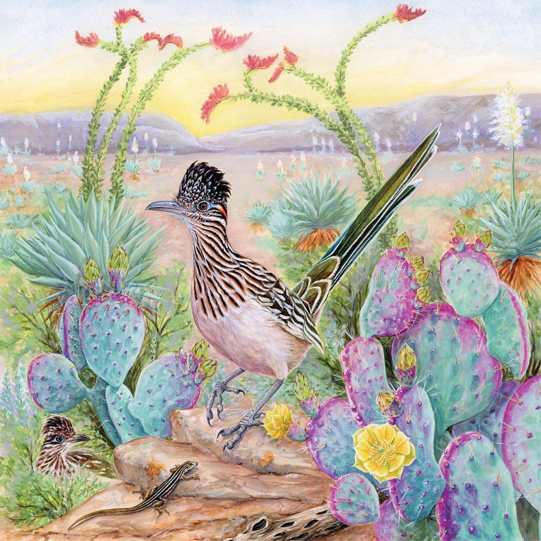 Greater roadrunner bird standing on desert ground surrounded by blooming prickly pear cacti and ocotillo flowers