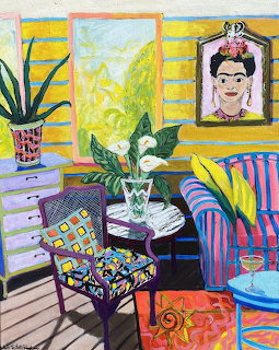 Colorful painted interior with Frida Kahlo portrait, striped sofa, patterned chair, and potted plants