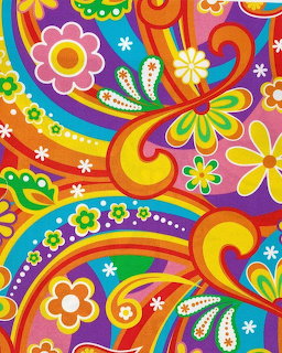 Colorful psychedelic retro floral pattern with swirls, daisies, and paisley in vibrant rainbow hues