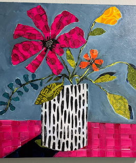 Mixed-media collage painting of pink, orange and yellow flowers in a black and white patterned vase