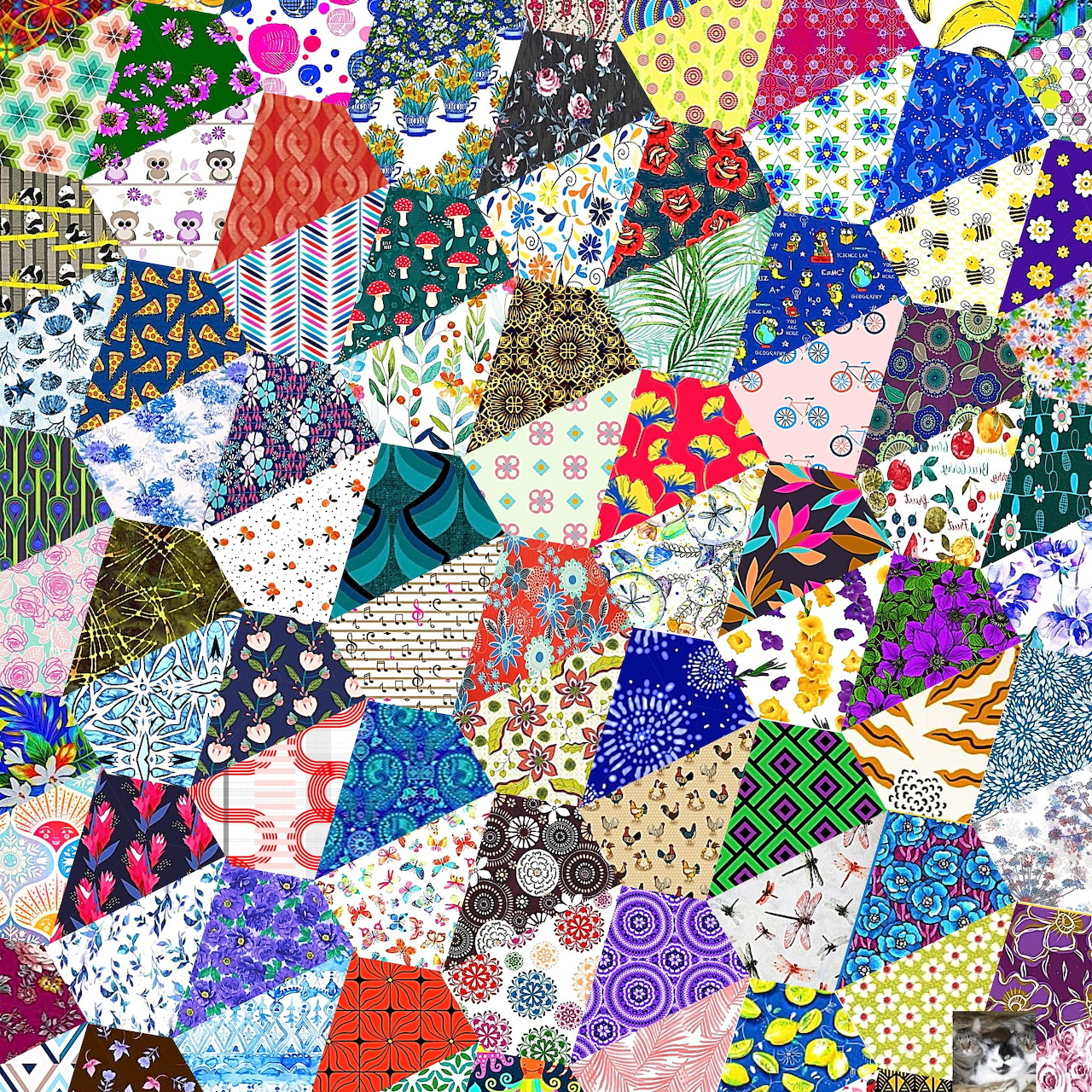Colorful hexagonal patchwork quilt with various fabric patterns including flowers, dots, and geometric shapes