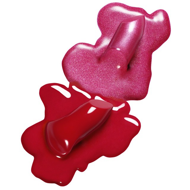 Glossy red and pink nail polish splashes on a white background