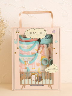Packaged gift hamper box with pastel baby items and decorative label