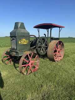 Vintage Rumely Oil Pull type H 16-30 tractor with tall stack and steel wheels
