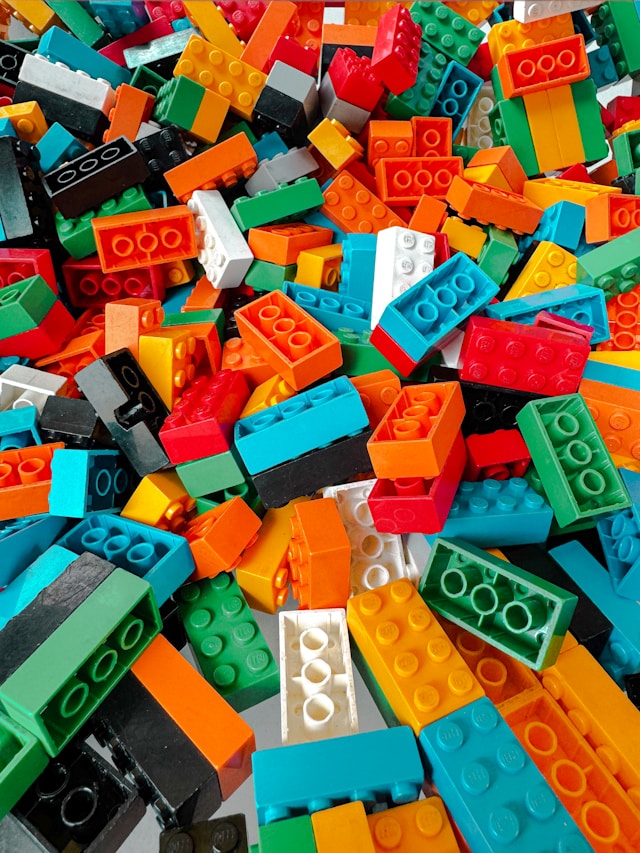 Close-up of colorful plastic building bricks scattered in a pile