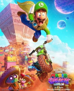 Mario character in green costume leaping through space above a desert town with floating planets and game elements