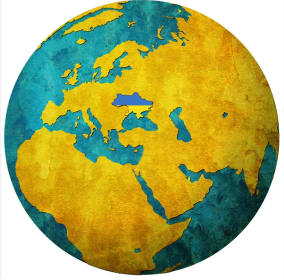 Illustrated globe map with Europe, Africa, and Asia in blue and golden yellow