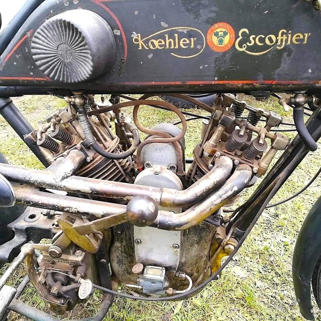 Vintage Koehler Escoffier motorcycle engine with exposed mechanics and exhaust pipes