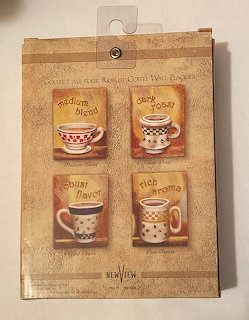 Packaged set of four decorative coffee cup wall plaques with retro styling