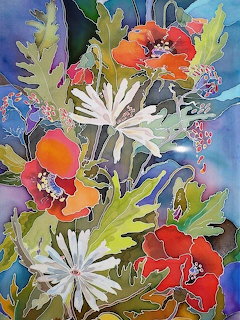 Vibrant batik-style painting of orange, white, and blue flowers with decorative leaves on a colorful patterned background
