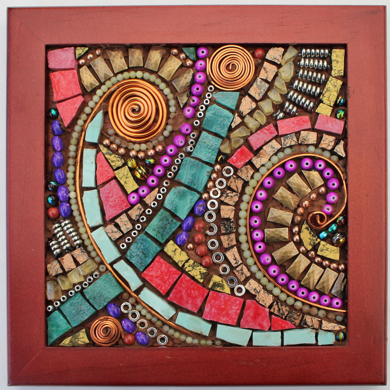 Abstract mosaic artwork with colorful tiles, spirals, and bead accents in a square frame