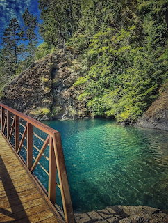 Wooden Bridge Over Turquoise Cove