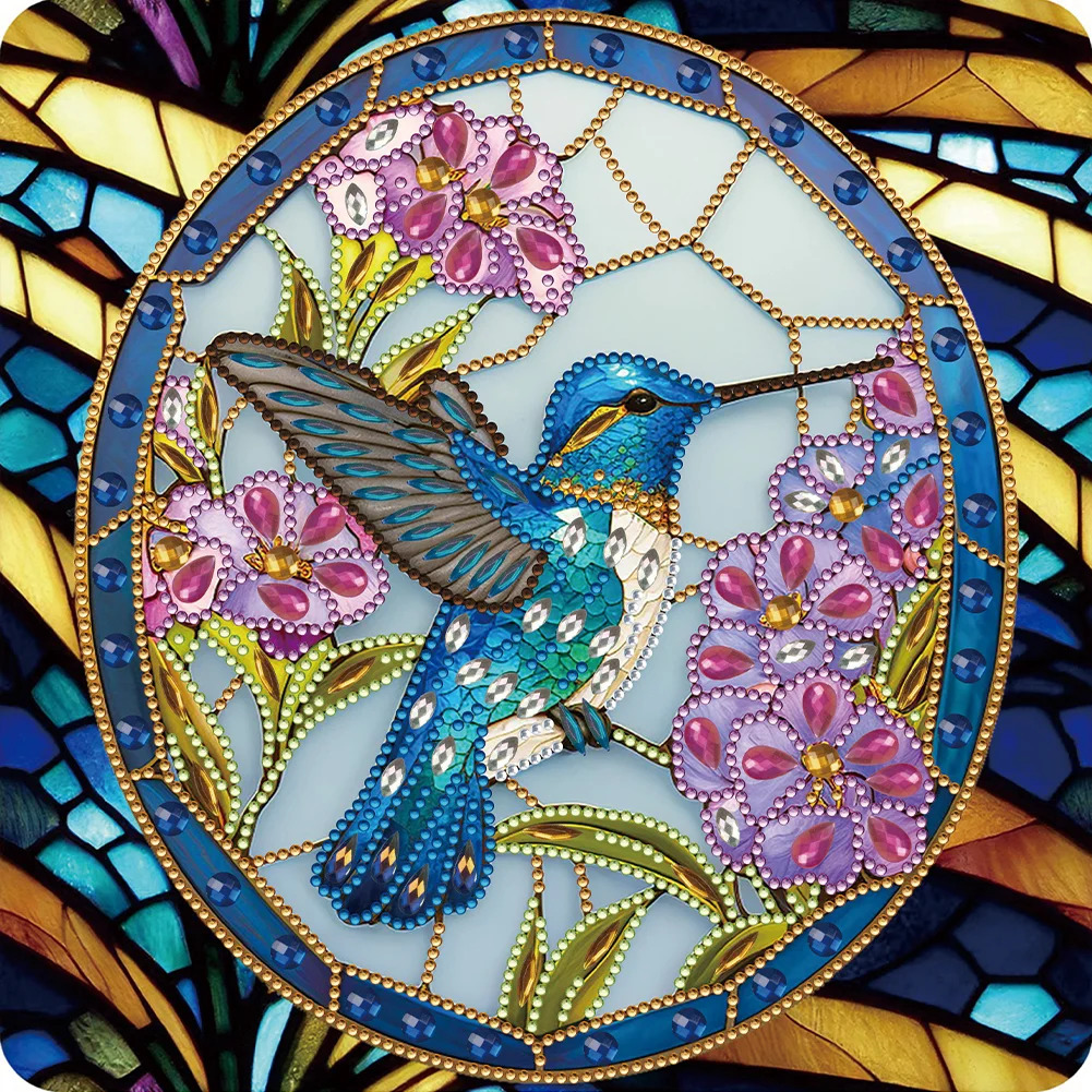 Blue hummingbird with pink flowers in decorative oval frame with colorful stained glass border