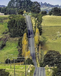 Rural Road Through Green Hills