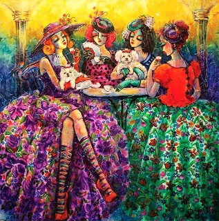 Four women in elaborate floral dresses having tea together at a table