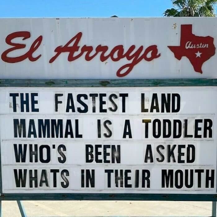 El Arroyo Austin marquee sign with a humorous saying on a white letter board outdoors