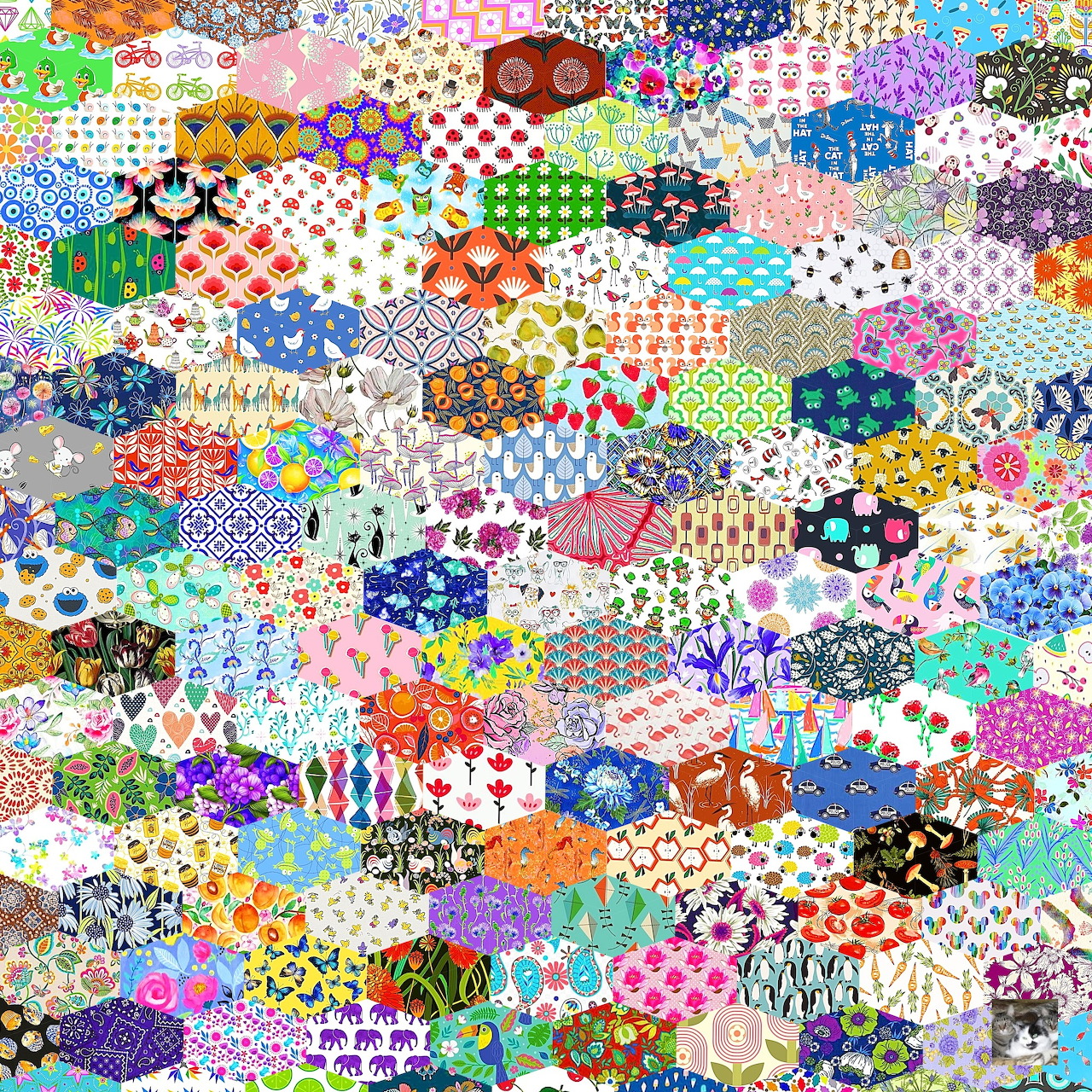 Colorful hexagonal patchwork quilt with diverse floral and geometric fabric patterns