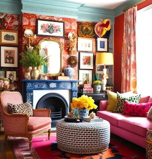Eclectic living room with colorful furniture, fireplace, artwork, and decorative accents