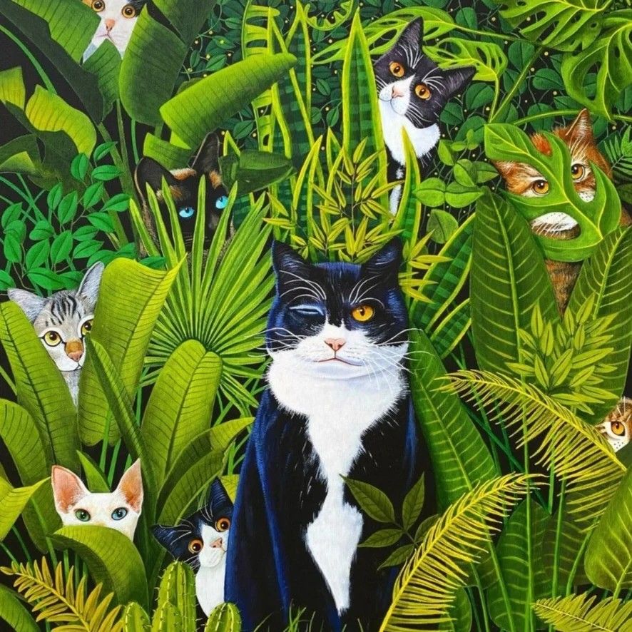Tuxedo cat among green jungle leaves with several hidden cats peeking out
