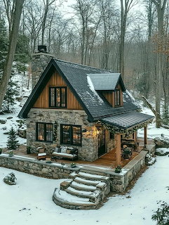 Stone and wood cottage with steep roof and covered porch in a snowy winter forest setting