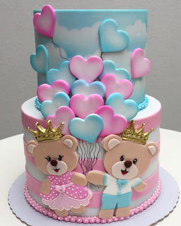Pastel cake with heart balloon decorations and teddy bear toppers wearing crowns