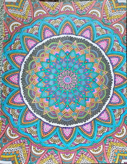Circular mandala with pastel colors and intricate geometric patterns on ornate floral background