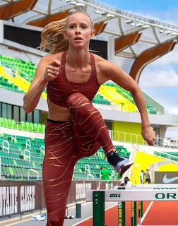 Woman Hurdling at Stadium