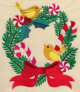 Embroidered Christmas wreath with birds, candy canes, holly, and red bow on beige background