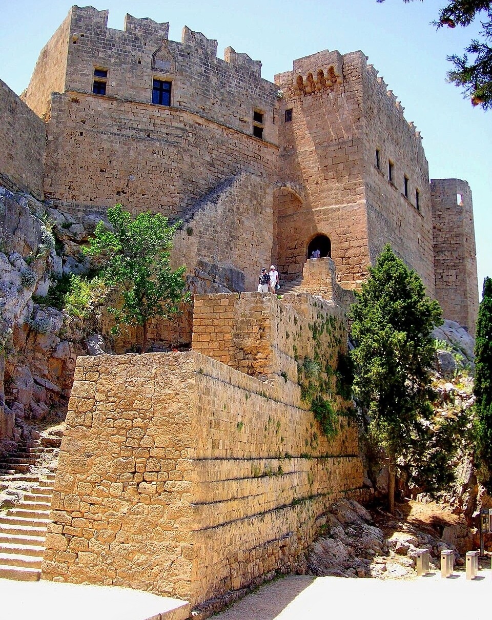 Stone fortress walls and stairway leading up to ancient Lindos Acropolis