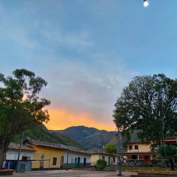 Sunset over village square in Mucuchachí, Venezuela with mountains and colonial buildings