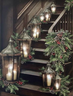 Staircase decorated with lanterns, pine garlands, pinecones and berries for Christmas