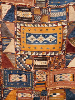 Collage of Moroccan tapestries with geometric patterns in orange, blue, and brown tones