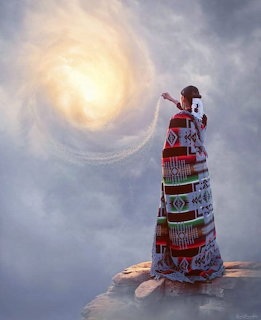 Woman in a patterned dress on a rock, reaching toward a glowing spiral in the cloudy sky.