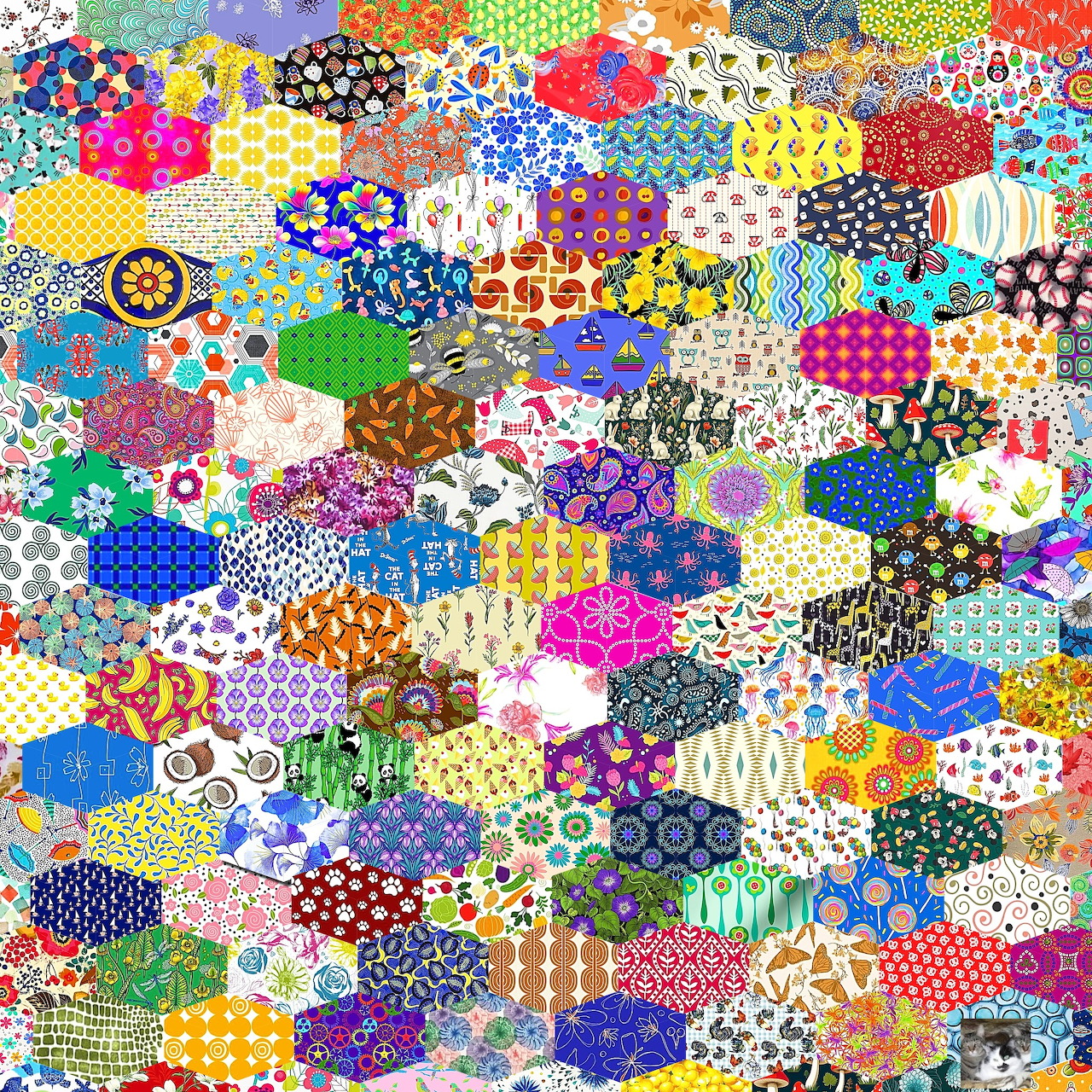 Colorful patchwork quilt with hundreds of small fabric patches in various patterns and colors