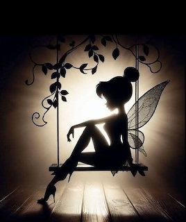 Silhouette of a fairy with wings sitting on a vine-covered swing against warm backlight