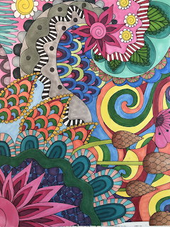 Colorful psychedelic collage with spirals, flowers, peacock feathers, and geometric patterns