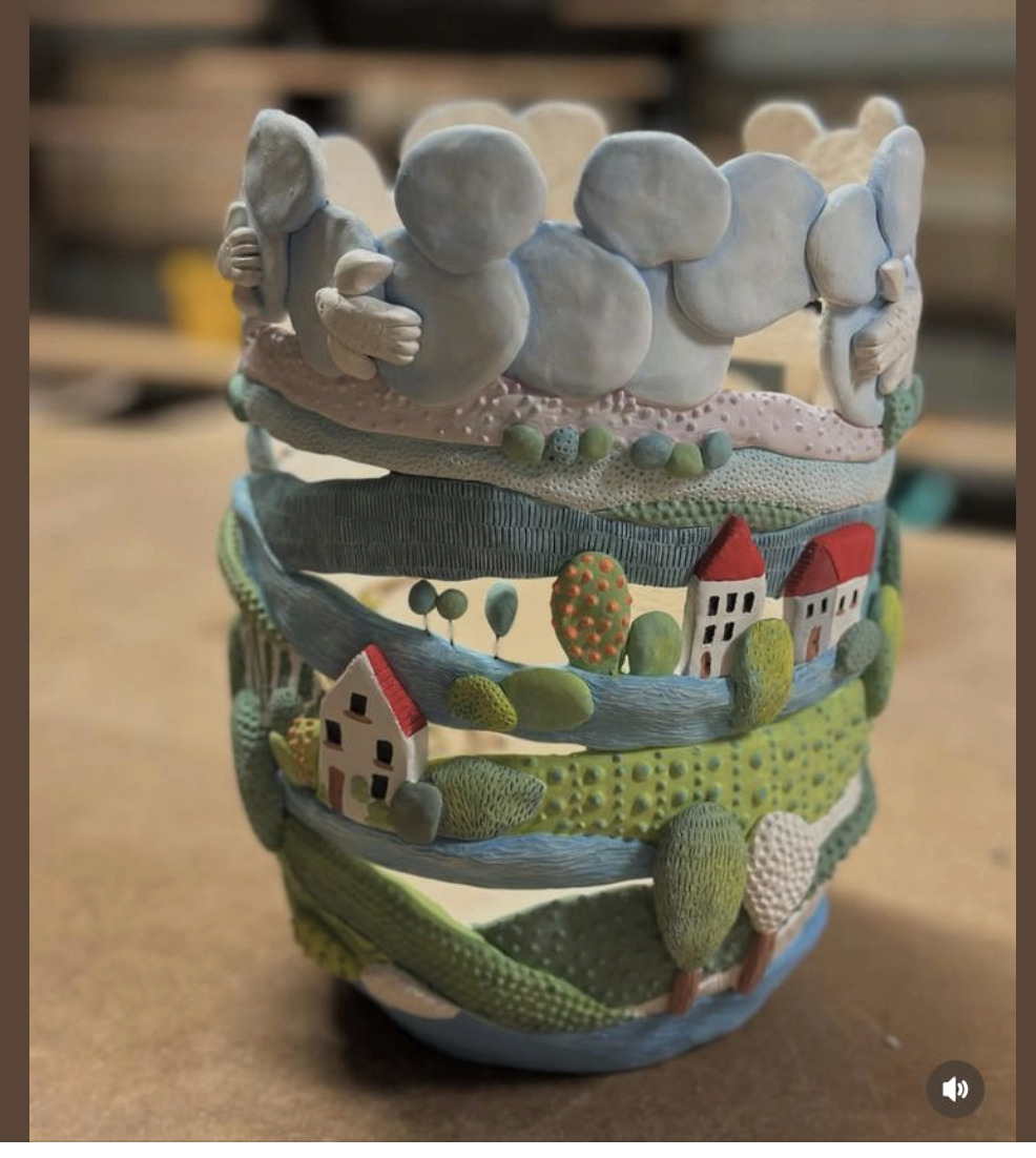 Ceramic bowl decorated with a painted landscape scene