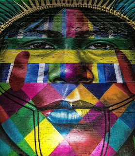 Geometric portrait of indigenous person with colorful painted patterns overlaying face