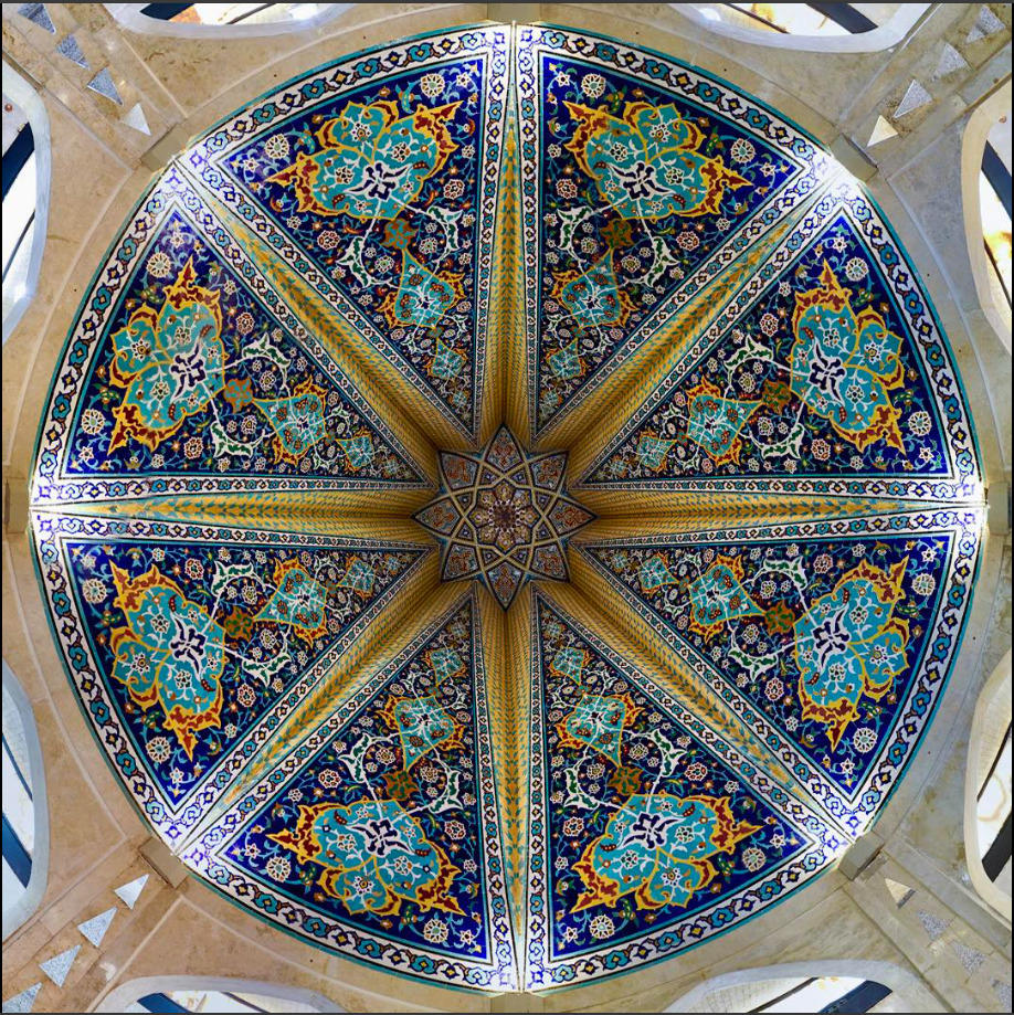Circular domed ceiling with elaborate Islamic geometric patterns and colorful Persian tilework in radial symmetry