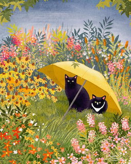 Two black cats under yellow umbrella in colorful flower garden
