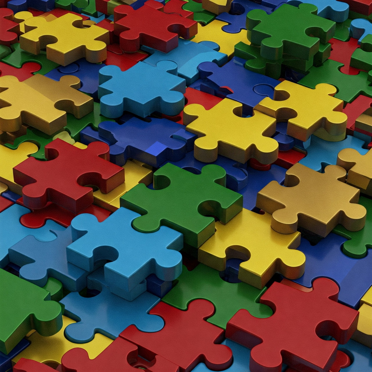 Close-up of colorful jigsaw puzzle pieces overlapping in a pile