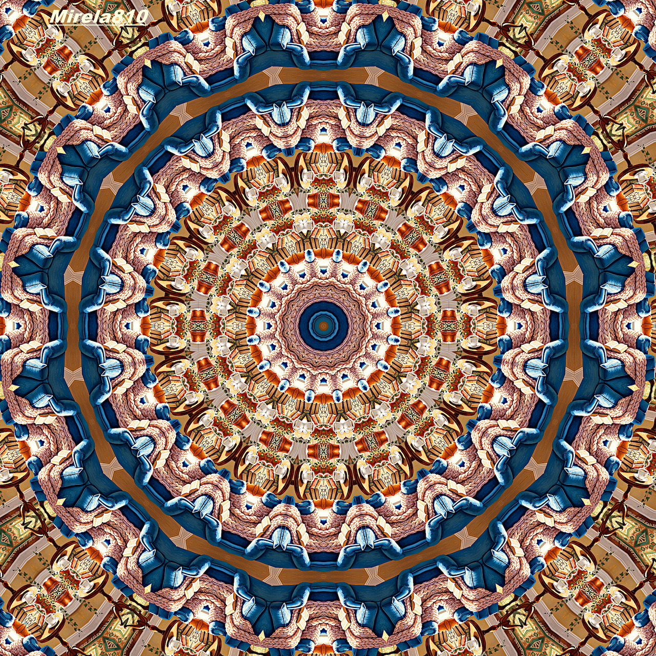 Detailed mandala with blue outer rings and orange geometric patterns in radial symmetry