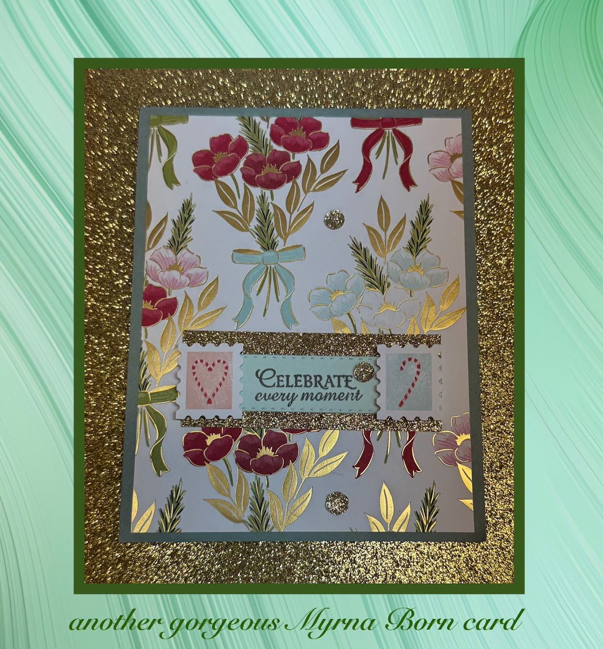Handmade card with red poppies, gold glitter frame, and celebrate text on green mat