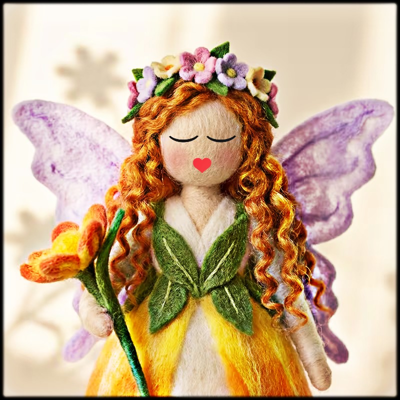 Handmade felt fairy doll with purple wings, curly orange hair, floral crown, and yellow green dress